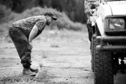 PORT PROTECTION, AK, USA: Timothy "Curly" Leach reviews the damage on his truck's flatbed in Port Protection, AK.