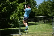 LONDON - Simon is not a professional rope climber and is attempting to climb a rope. He will use two rope climbing techniques. He is using the break and squat method here.