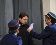 Lt. Col. Recordon (played by Mario Hermeto ) and Sgt. Major Phillipe Mathy (played by Rodrigo Candelot) confront the priest with a photo of Paul Touvier.