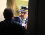 The priest tries to slam the door on Lt Col Recordon (played by Mario Hermeto) and Sgt Major Mathy (played by Rodrigo Candelot).