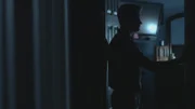 Man in a dark room.