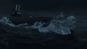 Submarine surface cruising during storm.