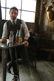 Magician Eric Leclerc performing tricks in between takes for Paper Bag Trick game, designed to tests participants' logic skills based on whether or not they can figure out how Eric transported a cup of water to another paper bag and crush it without water spilling everywhere.