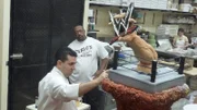 Buddy and Dana work on the WWE cake.