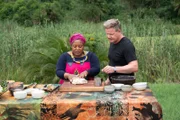 South Africa - Gordon Ramsay (R) watches as Chef Zola Nene kneads dough during the big cook.
