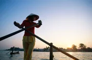 Can Tho, Vietnam --- Boat Woman on the Mekong River --- Image by © Steven Vidler/Eurasia Press/Corbis