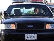 Las Vegas, NV - Sergeant Curtis sits in his police car as he attentitively watches the suspects during Car Thief.  (photo credit:  NGT/Corey Surratt)