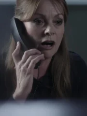 Michelle (Andrée Bernard) talking on the phone.