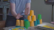 Lee needs to tidy up after a party - there are cups everywhere! To make it a speedy process he uses his special speed stacking skills.