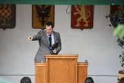 QUEENS, NY - The auctioneer acknowledges a bid during "Dollar Auction." (NGT/Stephen Holtzhauser)