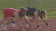The Twins take to the track for a sprint race. Chris uses a dynamic warm up and Justin drinks coffee before the race. The Twins are in their starting positions.