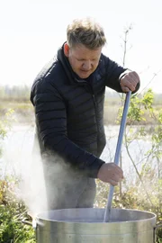 Louisiana - Gordon Ramsay stirs Viet-Cajun style crawfish consisting of lemon, garlic and seasoning. (Credit: National Geographic/Rush Jagoe)