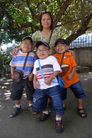 Three boys with their mother.