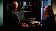 Dave Schrader (left) interviews Kari Wilson, tour guide (right), about her personal paranormal experiences at the Surratt Tavern in Clinton MD, as seen on Travel Channel's The Holzer Files.