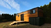 The SO Tiny Homes crew surprised tiny home owner Michael Thompson with a garage beneath the gooseneck to store his motorcycle, as seen on Tiny House, Big Living.