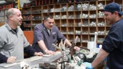 Wayde, Brett and Nick are discussing the inserts in the work station.