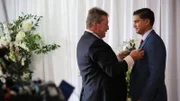 Kara's uncle helps Guillermo with his boutineer on his wedding day.