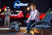 Richard Hammond on the Top Gear set while filming links for Top Gear’s Top 41 with The Stig in the background.