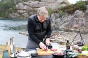 Bergen, Norway - Gordon Ramsay cutting reindeer meat for stew during the big cook. (Credit: National Geographic/Justin Mandel)