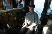 Landen Young in the old man's wheel chair, while George Young is diving.