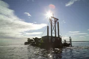 The anchored Christine Rose dumps material back into the Bering Sea.