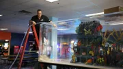 Wayde fills the tank with water.