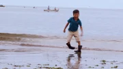 Peruvian boy with sideways feet.