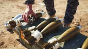 Mosul, Iraq - An Iraqi Federal Police Officer displays the mortar rounds his unit deploys against ISIS.