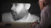 Dave Schrader watches the video.