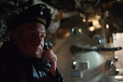 Close-up on sweaty faces of the CREW filled with fear.