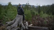 PORT PROTECTION, ALASKA- Mary breaks from her ptarmigan hunt to enjoy the peaceful woods near Port Protection. (Photo Credit: National Geographic Channels/ Will Lyons)