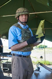 ONTARIO - RE-ENACTMENT - Investigator (played by Dmitry Chepovetsky) studies a piece of wreckage in the crash site tent.