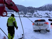 Thord pulls the car backwards out of the field in Dimmelsvik, Norway.