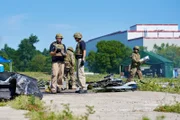 ONTARIO - RE-ENACTMENT - Investigator (played by Dmitry Chepovetsky) and his team (played by background performers) study the crash site.