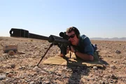 Sean shoots a rifle in the desert – the bullet is the inspiration behind designing a plane so aerodynamic that it travels faster than the speed of sound