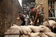 Dieter and a Luftwaffe Helper climb over the barricades holding Panzerfausts.