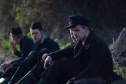 Wittman and crew resting by roadside.