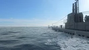 Ein computergeneriertes Bild zeigt die USS Batfish beim Kreuzen an der Oberfläche während des Tages.  (Pazifikflotte II Produktionen, Inc.)