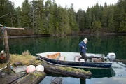 PORT PROTECTION, ALASKA- Gary Muehlberger visits his old floathouse in Port Protection, AK, and is disappointed to see it's dilapidated condition.  (Photo Credit: National Geographic Channels/ Joshua "J.J." Krehbiel)