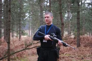 Breivik walks through the forest hunting down children to kill.