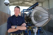 Sean next to the sabre engine at Reaction Engines in Colorado.