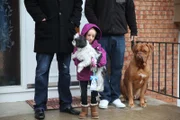 Hannah and brothers Matt and Mark Kritzeck walk the dogs together.