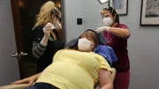 Dr. Lee and assistant work on Stacie’s head