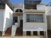 Exterior shot of the Big townhouse property in Granada, Spain as seen on J.J. Mulligan and Alejandra Piquers house tour for House Hunters International. (exterior)