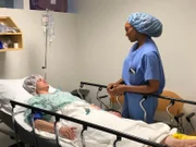 Dr. Vincent reassuring Michele Martinez after surgery