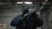 Person mit Waffe