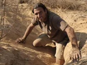 Hazen Audel beside porcupine hole. He had to dig for hours in order to break the ceiling of the porcupine hole, which he had to do if he wants to kill the porcupine for its meat.