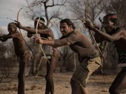 Hazen, Touka, Mosse and Jonas with bow and arrows. Although Hazen uses a modern bow at home, he struggles with this smaller one.