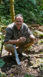 Papua New Guinea - Marty Morgan in Etoa jungle with remnants of Australian and Japanese machine guns. (National Geographic/Martin Kemp)