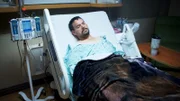 Benji lays in hospital bed